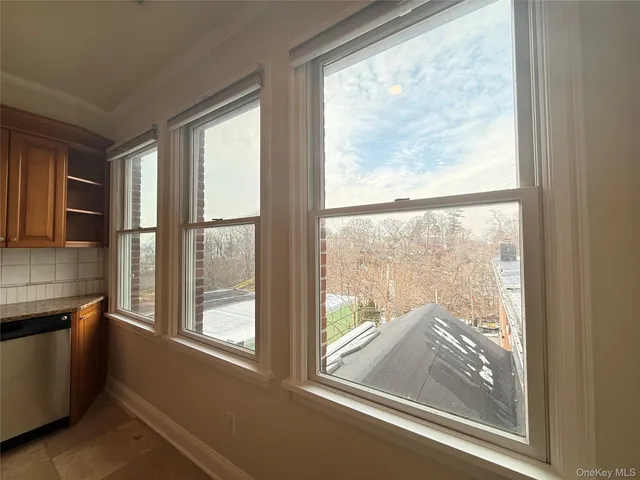 a view of a room that has a large window