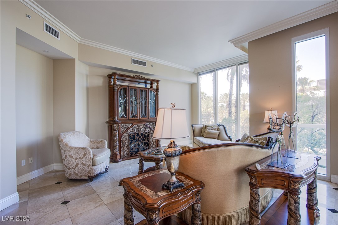 2857 Paradise Road, Unit 206 Las Vegas, NV 89109 - Photo 14 of 31 Sitting room with ornamental molding and light tile patterned flooring