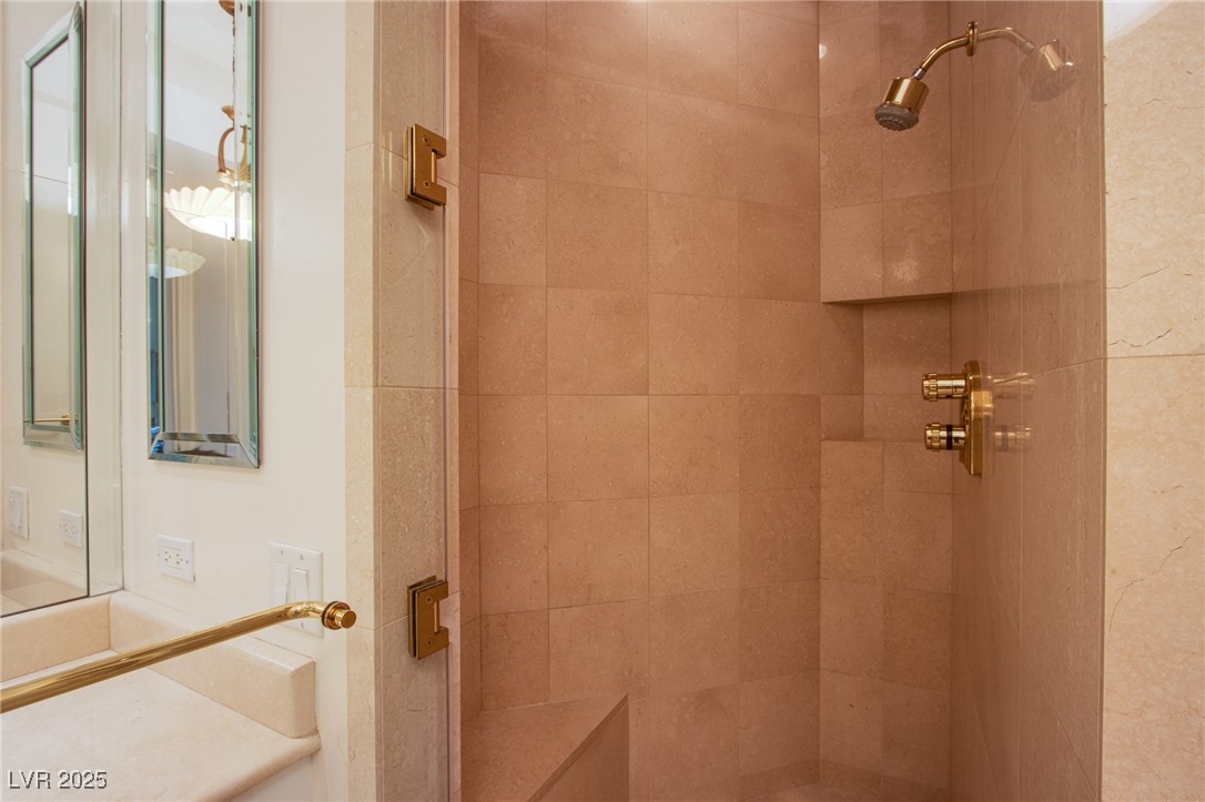 2857 Paradise Road, Unit 206 Las Vegas, NV 89109 - Photo 27 of 31 Full bathroom featuring a tile shower and vanity