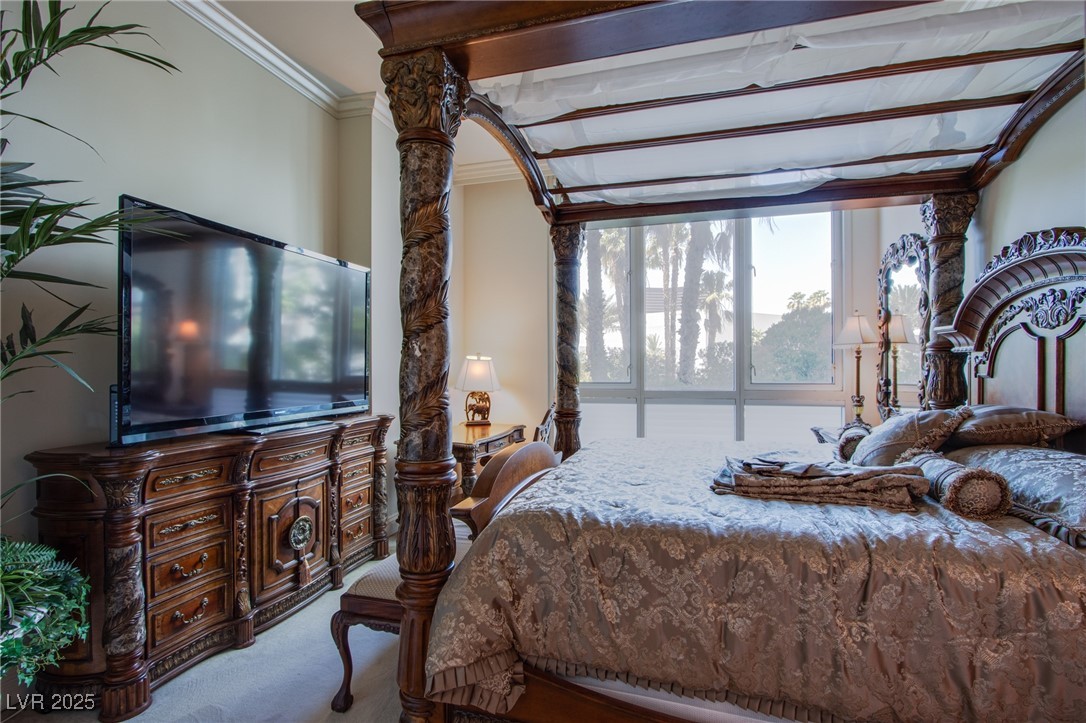 2857 Paradise Road, Unit 206 Las Vegas, NV 89109 - Photo 7 of 31 Carpeted bedroom featuring crown molding