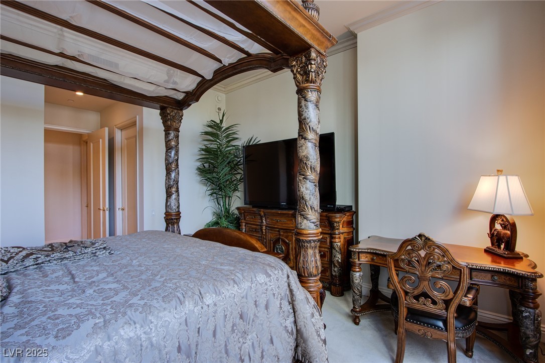 2857 Paradise Road, Unit 206 Las Vegas, NV 89109 - Photo 8 of 31 Bedroom featuring carpet flooring and crown molding