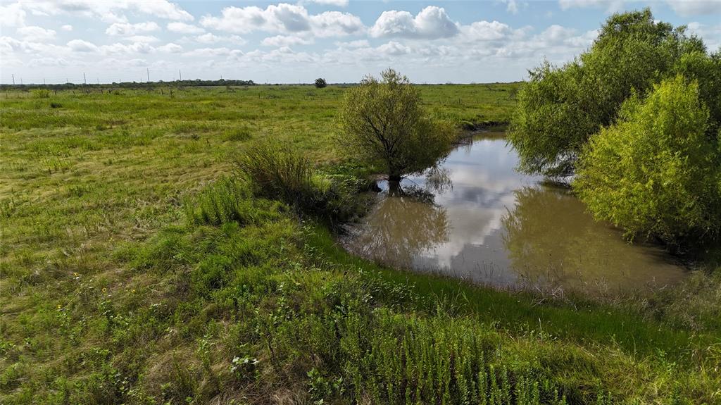 Lot 25 Northwest County 2170 Road Barry, TX 75102 - Photo 32 of 39 a view of a lake with a building in the background