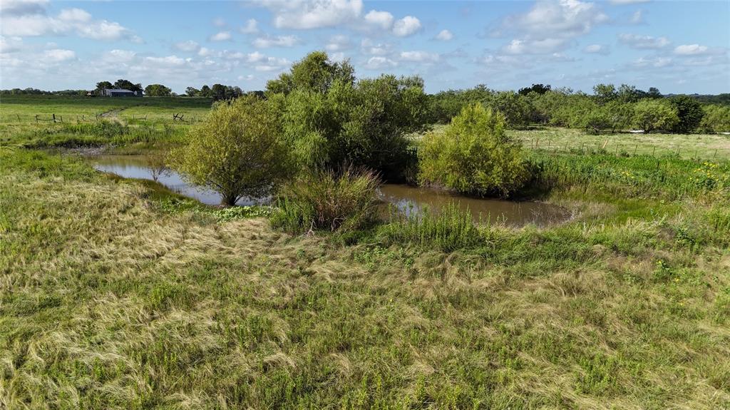 Lot 25 Northwest County 2170 Road Barry, TX 75102 - Photo 4 of 39 a view of a garden with a building in the background