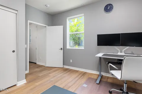 a workspace with furniture and a window