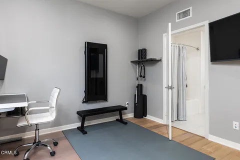 a view of a livingroom with furniture and a flat screen tv