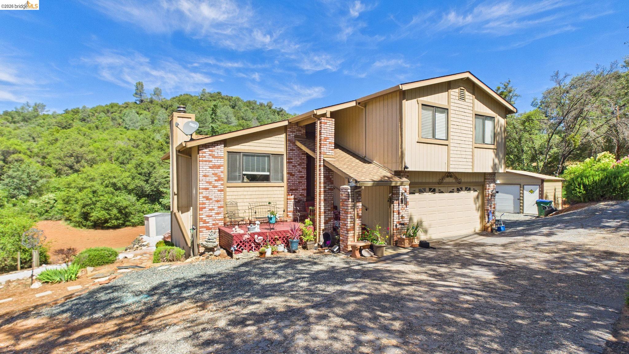 11858 Campo Seco Road Sonora, CA 95370 - Photo 6 of 45 Two-story residence featuring a combination of horizontal siding and brick accents