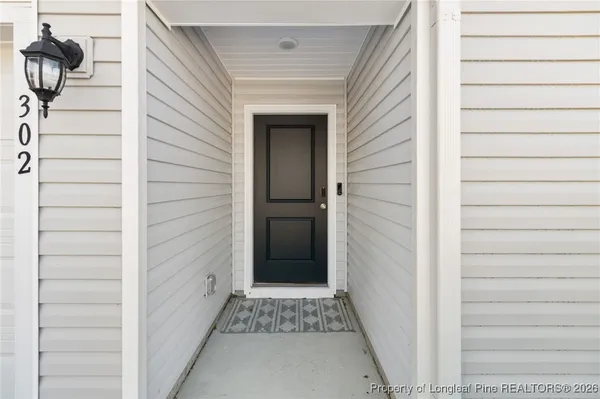 a view of a door and a window