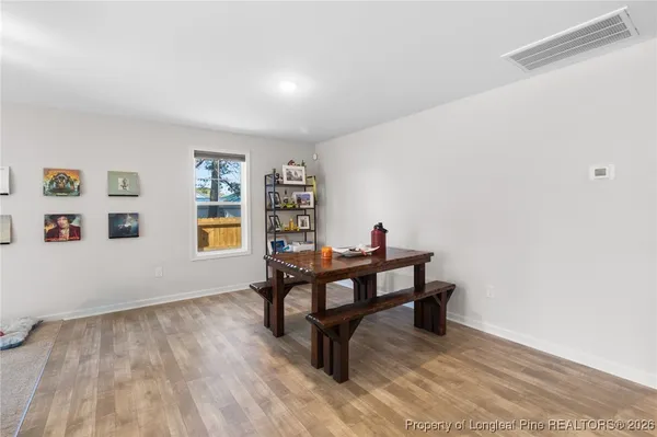 a bench sitting in a room next to a window