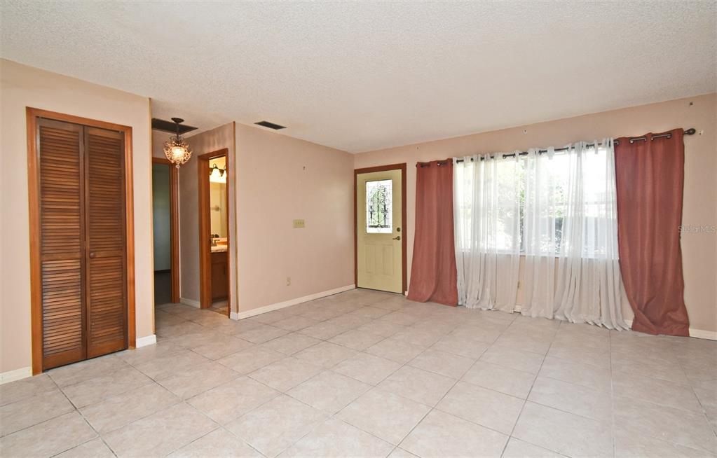 741 Arlene Drive Deltona, FL 32725 - Photo 11 of 34 an empty room with windows and closet