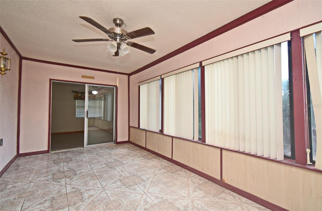 741 Arlene Drive Deltona, FL 32725 - Photo 20 of 34 a view of a porch with a ceiling fan