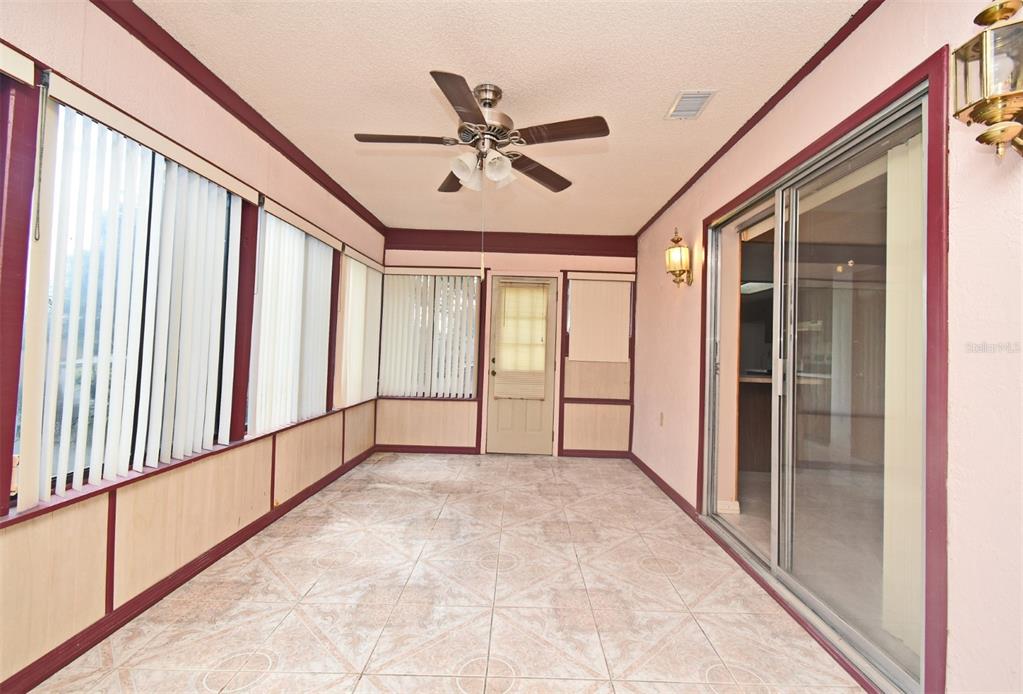 741 Arlene Drive Deltona, FL 32725 - Photo 22 of 34 a view of a hallway with a ceiling fan