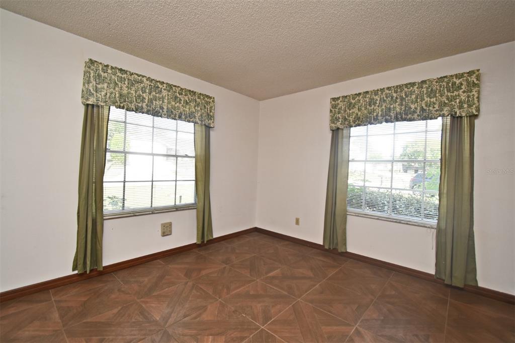 741 Arlene Drive Deltona, FL 32725 - Photo 23 of 34 an empty room with windows