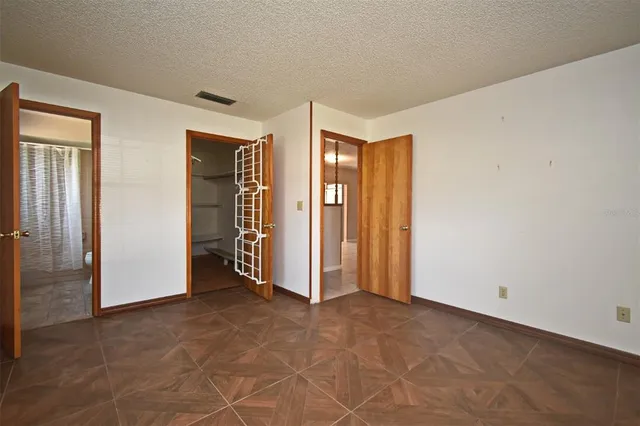 an empty room with closet area