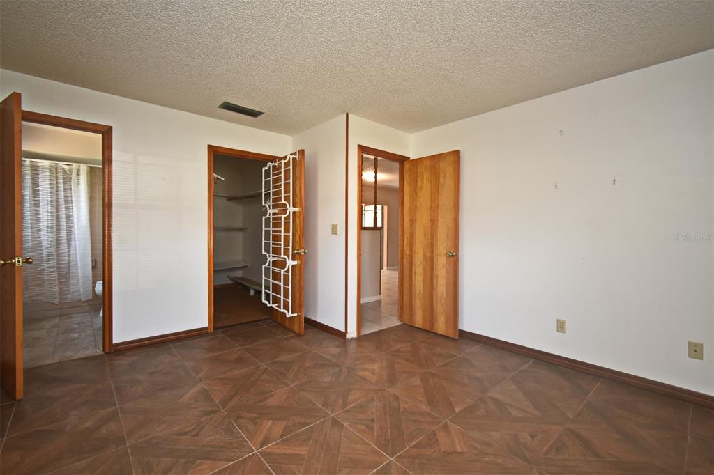 741 Arlene Drive Deltona, FL 32725 - Photo 24 of 34 an empty room with closet area