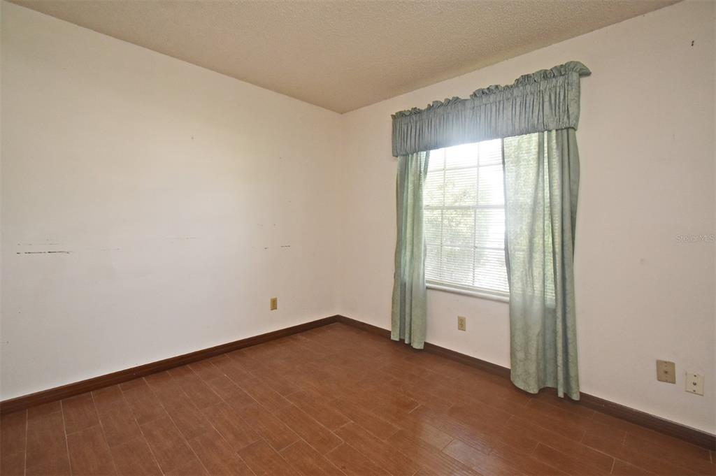 741 Arlene Drive Deltona, FL 32725 - Photo 27 of 34 an empty room with a window