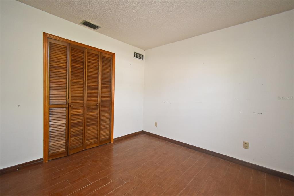 741 Arlene Drive Deltona, FL 32725 - Photo 28 of 34 an empty room with walk in closet and empty room