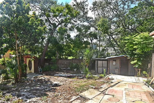 a tree in front of a house