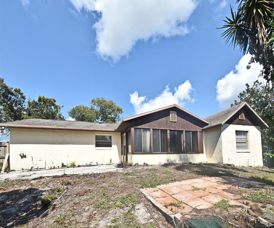 741 Arlene Drive Deltona, FL 32725 - Photo 10 of 34 a front view of a house with a yard