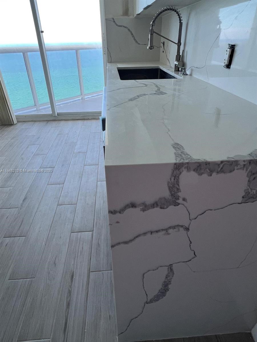 6301 Collins Avenue, Unit 3002 Miami Beach, FL 33141 - Photo 14 of 27 a room with a sink