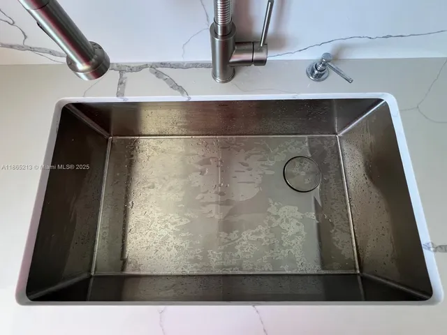 a bathroom with a sink a toilet and bathtub