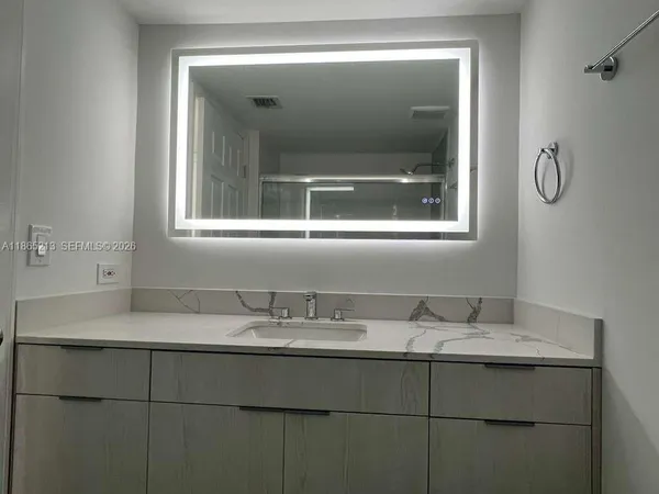 a view of a garden with a fountain