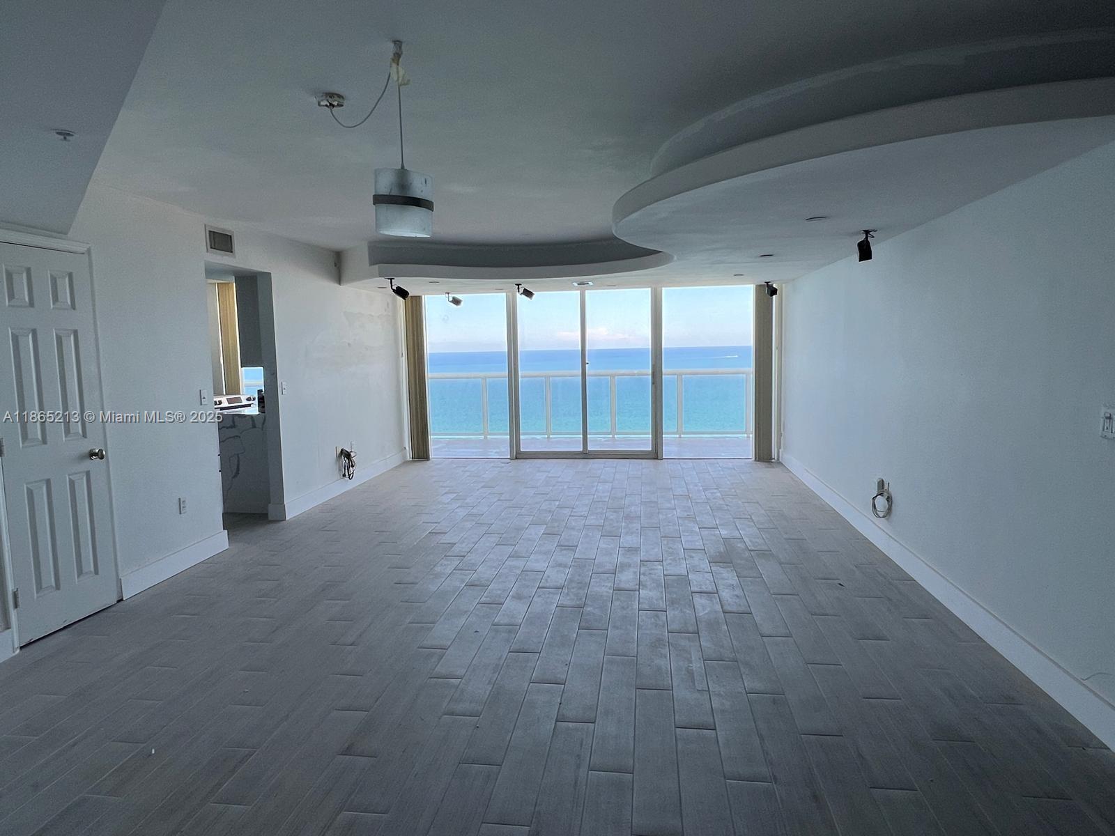 6301 Collins Avenue, Unit 3002 Miami Beach, FL 33141 - Photo 8 of 27 a view of an empty room with a window