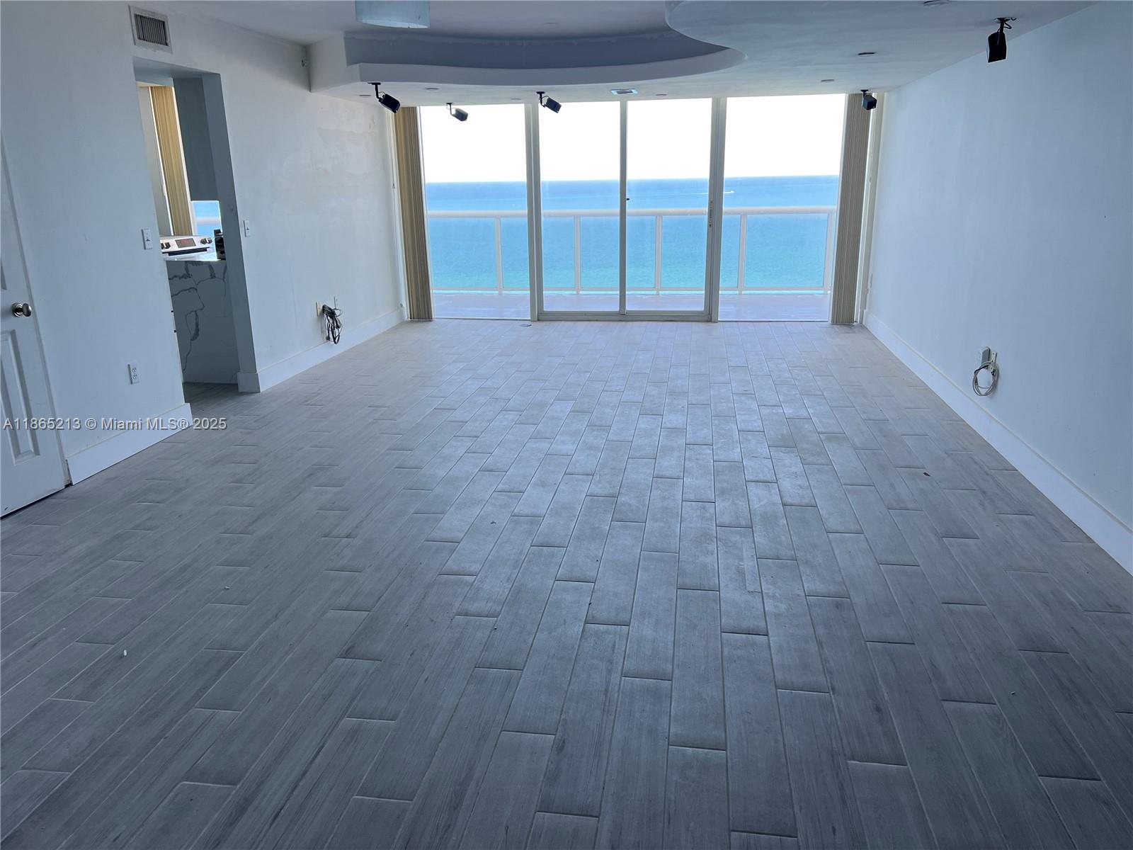 6301 Collins Avenue, Unit 3002 Miami Beach, FL 33141 - Photo 9 of 27 a view of an empty room with a window