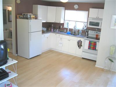 61 Mariposa Road San Rafael, CA 94901 - Photo 8 of 12 Unit A Kitchen with Easy Cleaning Melemine Cabinets, Formica Counter, Stainless Sink, Smooth Top Electric Range and GE Microwave Hood.