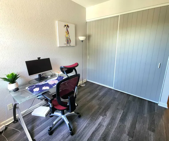 a workspace with furniture and wooden floor