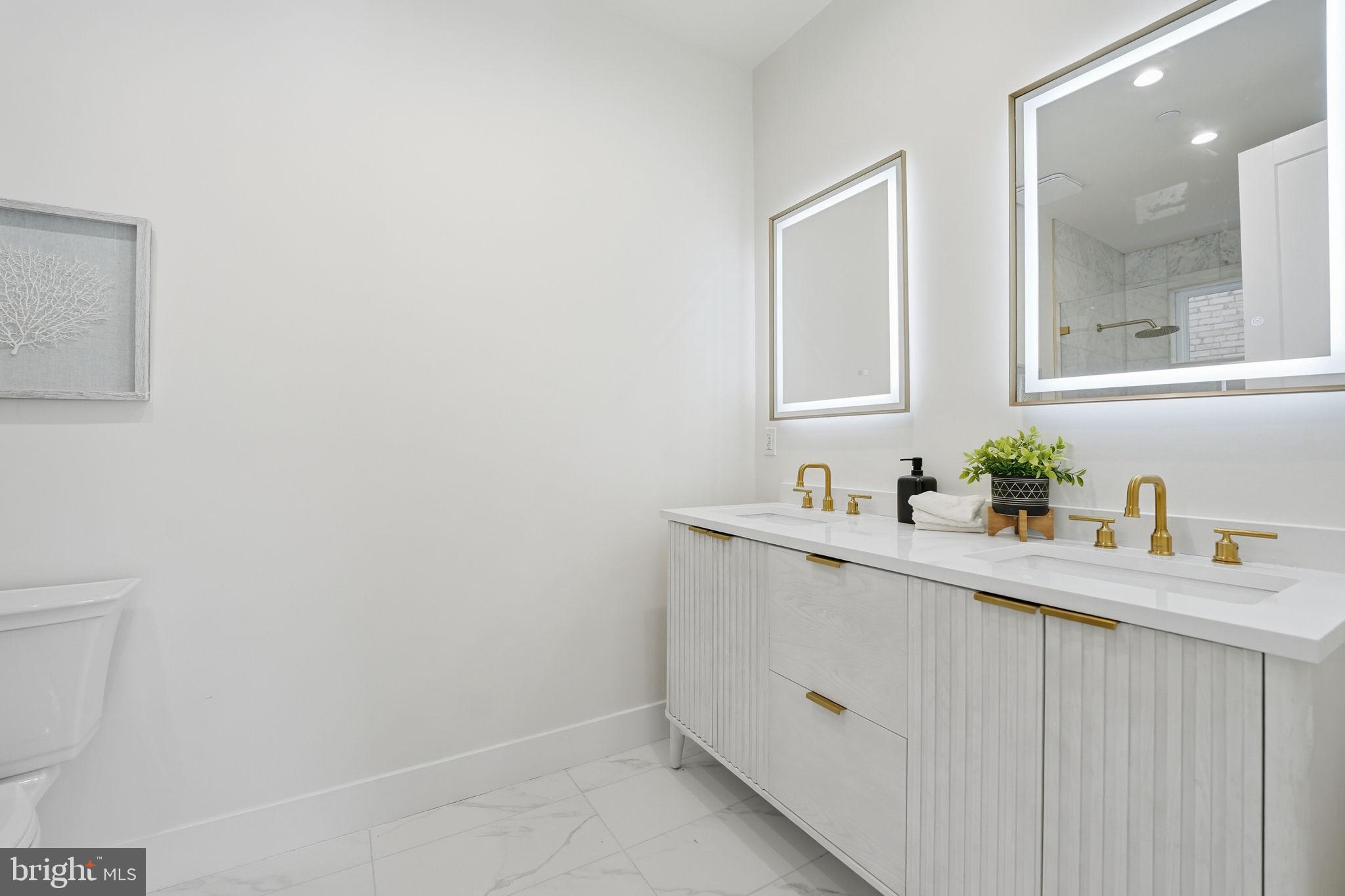 3916 8th Street Northwest, Unit B Washington, DC 20011 - Photo 13 of 24 a bathroom with a sink and a mirror
