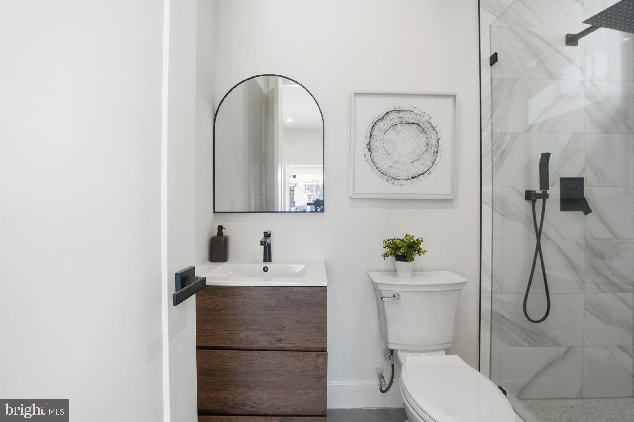 3916 8th Street Northwest, Unit B Washington, DC 20011 - Photo 20 of 24 a bathroom with a sink toilet and shower