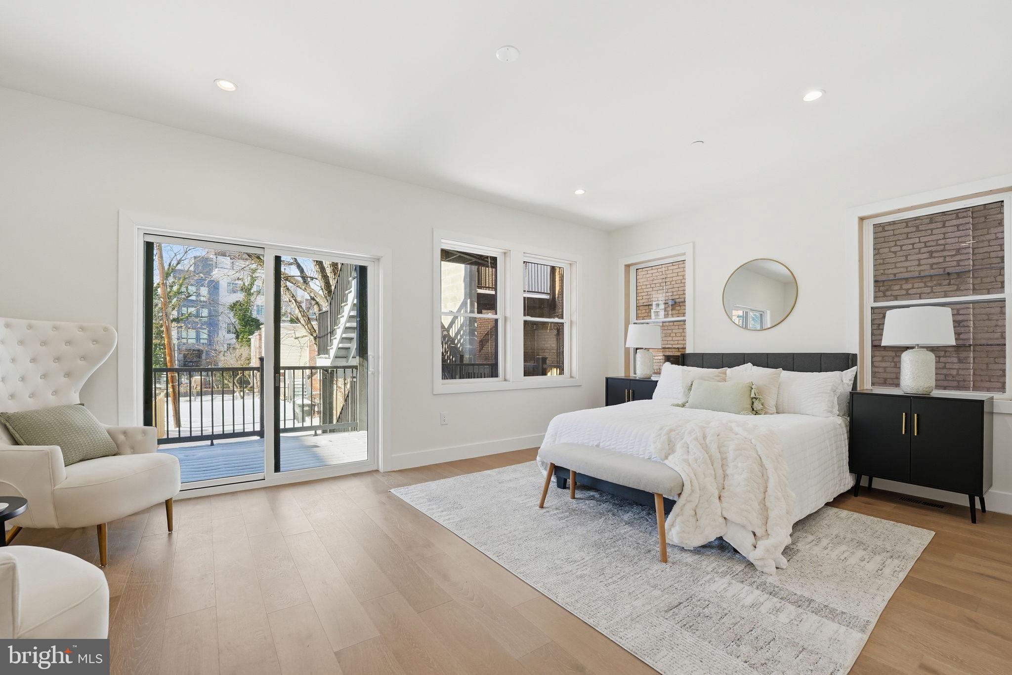 3916 8th Street Northwest, Unit B Washington, DC 20011 - Photo 4 of 24 a spacious bedroom with a large bed and a window