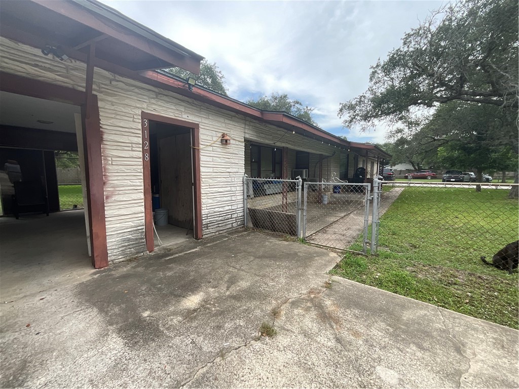 3128 Hackberry Street Ingleside, TX 78362 - Photo 11 of 11 a view of a backyard with table and chairs and potted plants