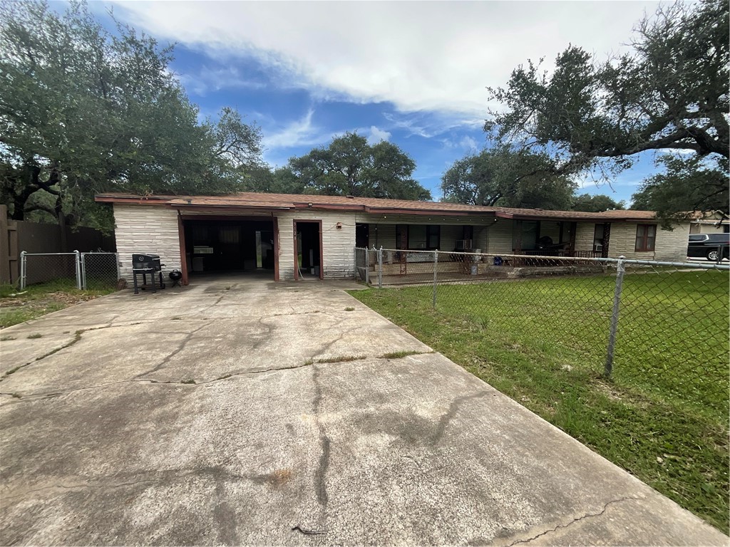 3128 Hackberry Street Ingleside, TX 78362 - Photo 2 of 11 front view of a house with a yard