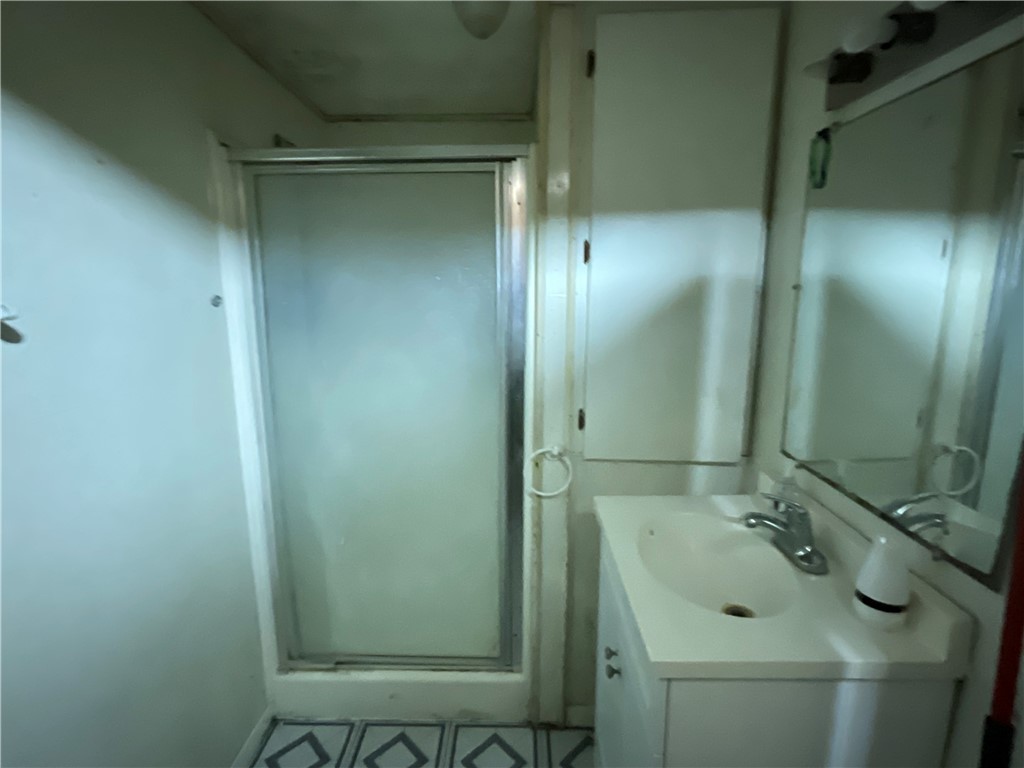 3128 Hackberry Street Ingleside, TX 78362 - Photo 7 of 11 a bathroom with a sink and shower