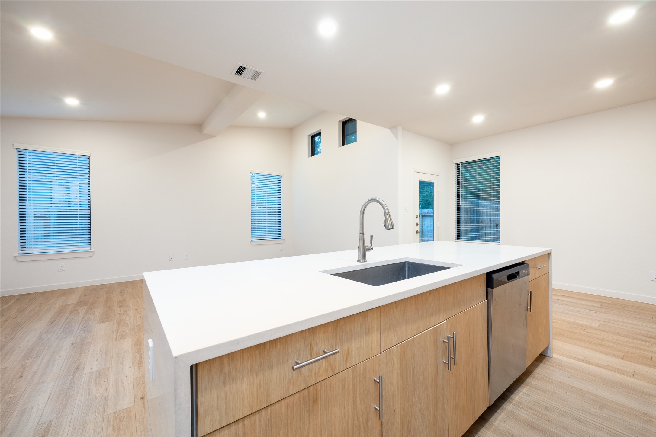 2517 Appian Way, Unit B Roman Forest, TX 77357 - Photo 11 of 37 a kitchen with a sink and wooden floor