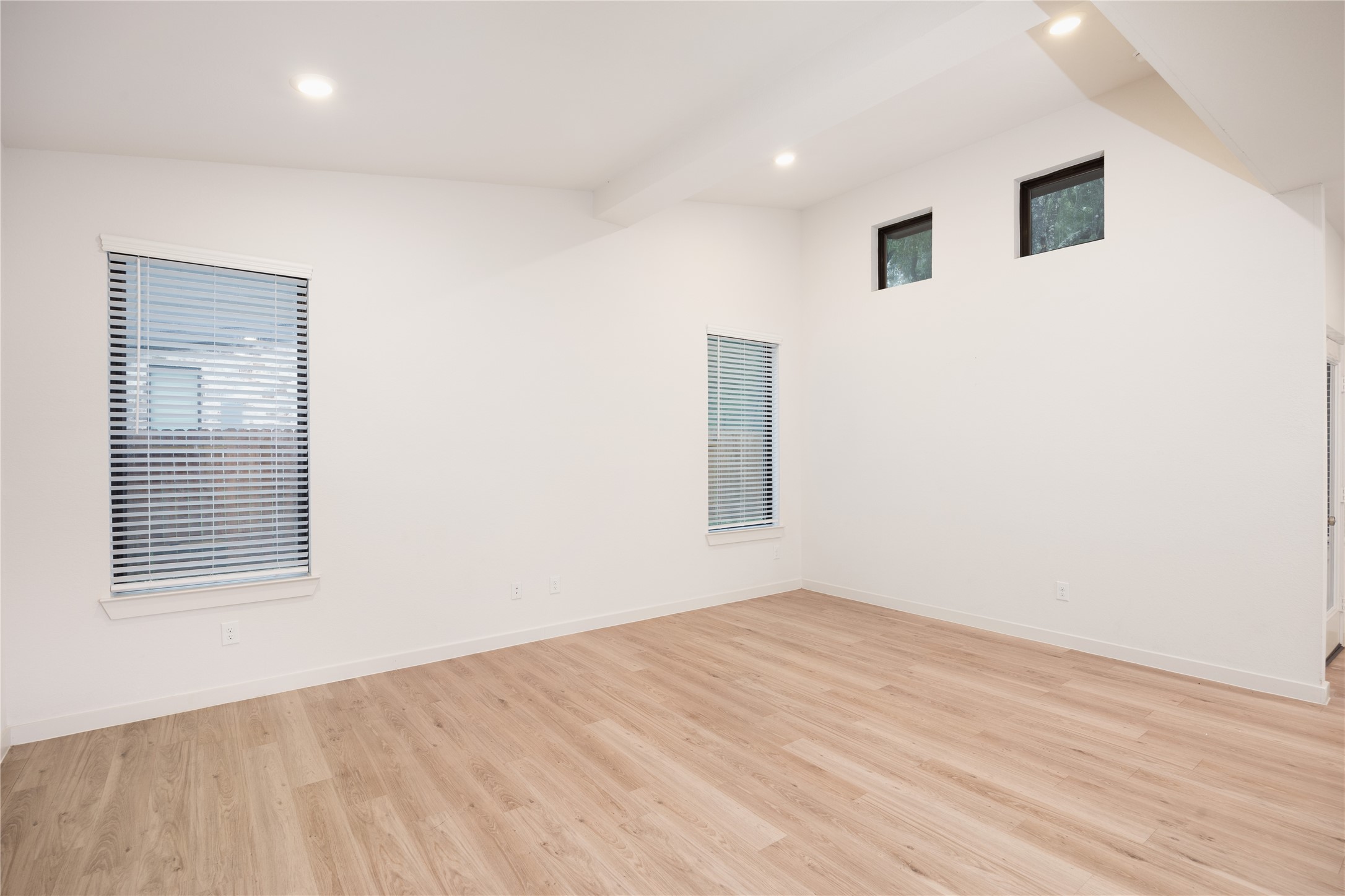 2517 Appian Way, Unit B Roman Forest, TX 77357 - Photo 19 of 37 a view of empty room with wooden floor