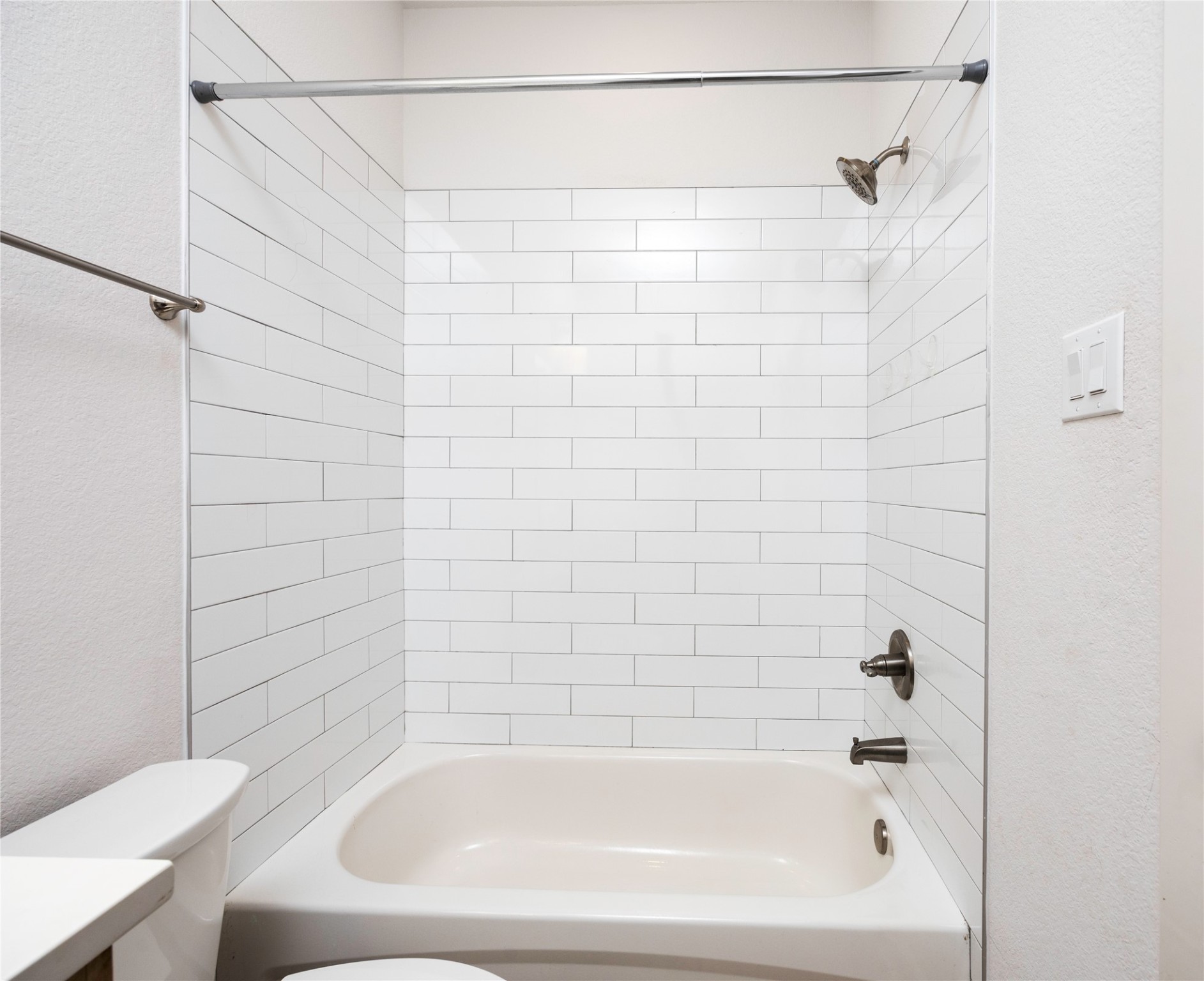 2517 Appian Way, Unit B Roman Forest, TX 77357 - Photo 26 of 31 a bathroom with a bathtub