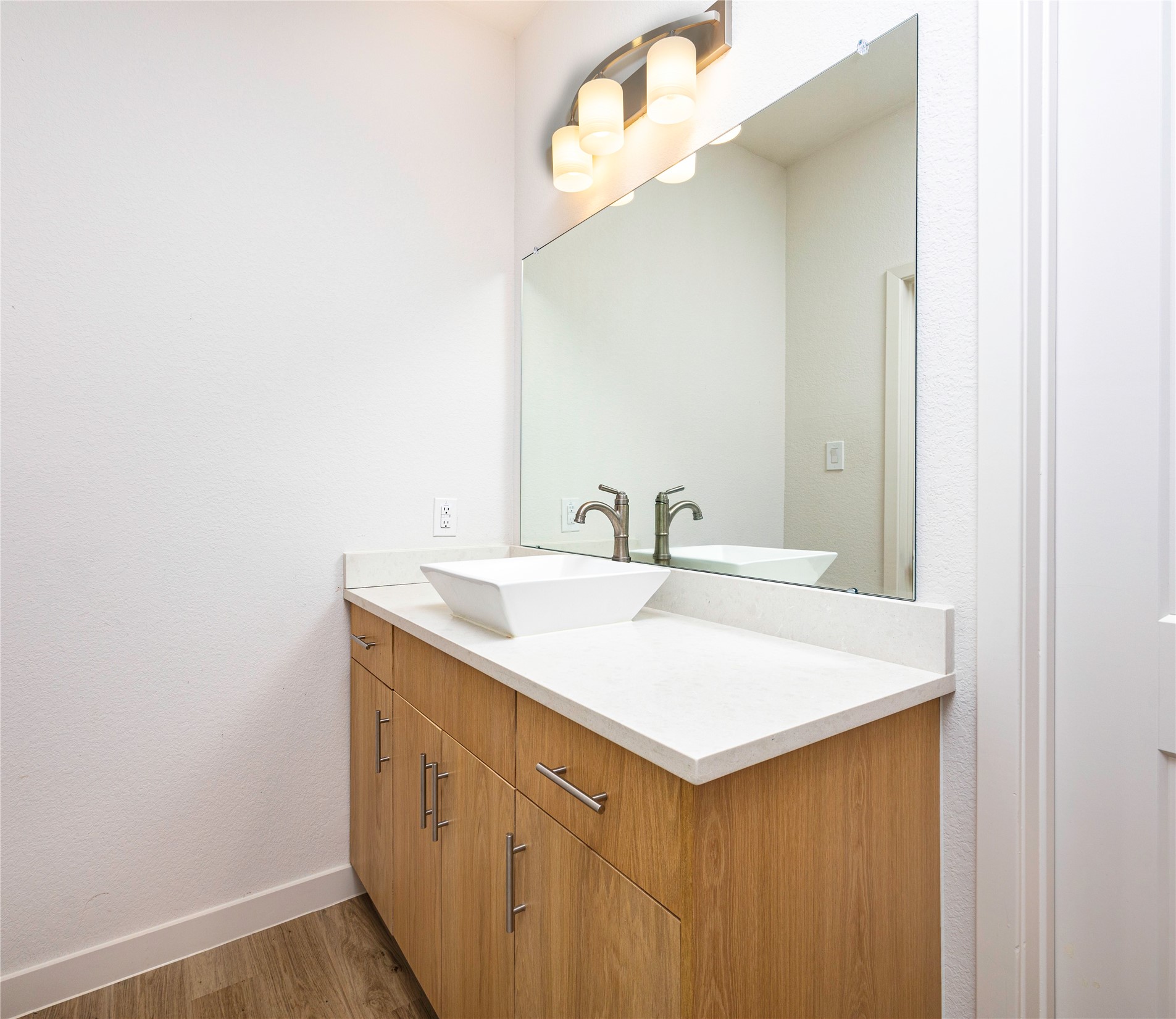2517 Appian Way, Unit B Roman Forest, TX 77357 - Photo 26 of 37 a bathroom with a sink vanity and a mirror