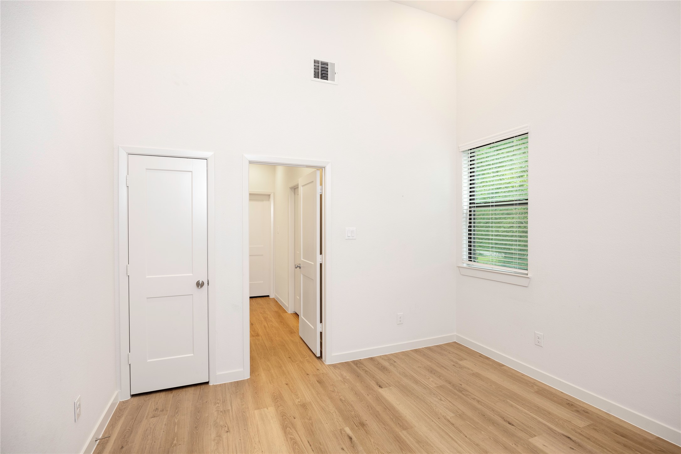 2517 Appian Way, Unit B Roman Forest, TX 77357 - Photo 30 of 37 a view of an empty room with wooden floor and a window