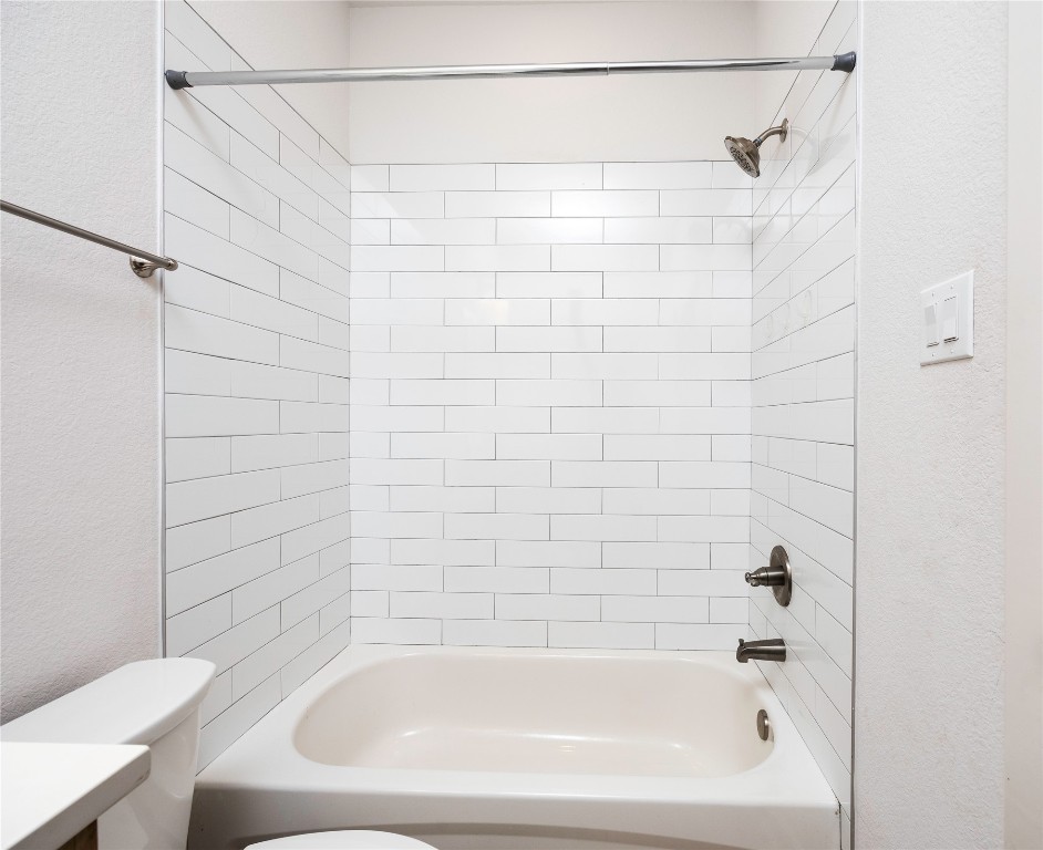 2517 Appian Way, Unit B Roman Forest, TX 77357 - Photo 32 of 37 a bathroom with a bathtub