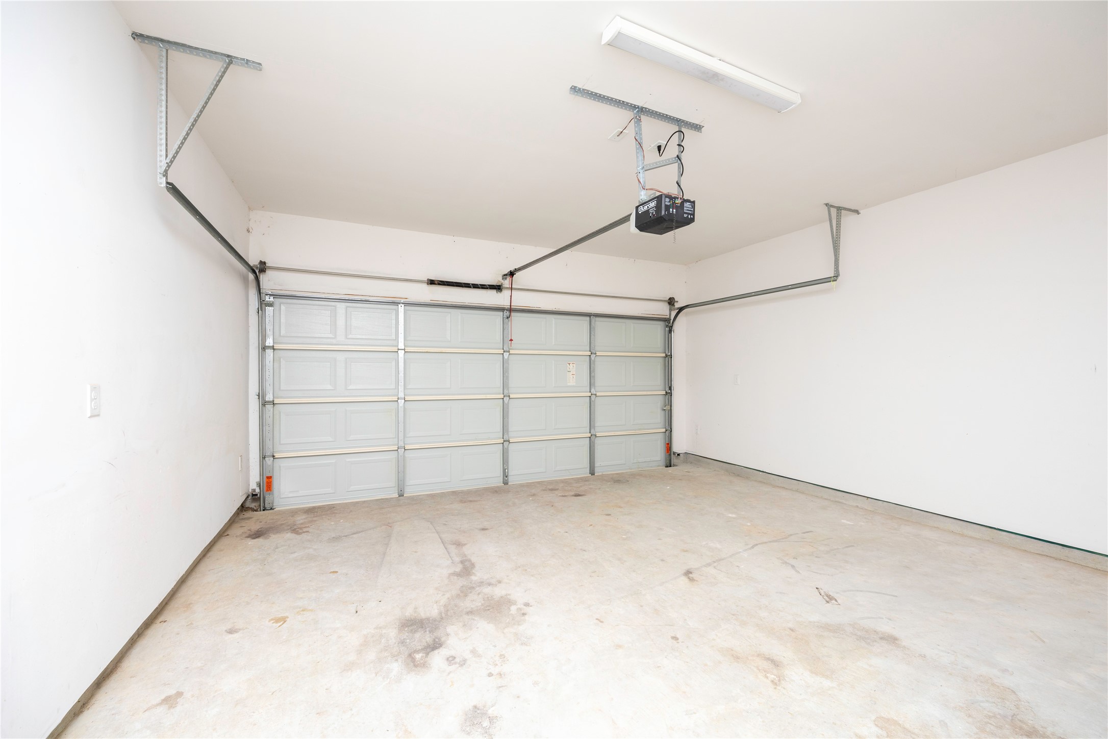 2517 Appian Way, Unit B Roman Forest, TX 77357 - Photo 35 of 37 a view of a garage