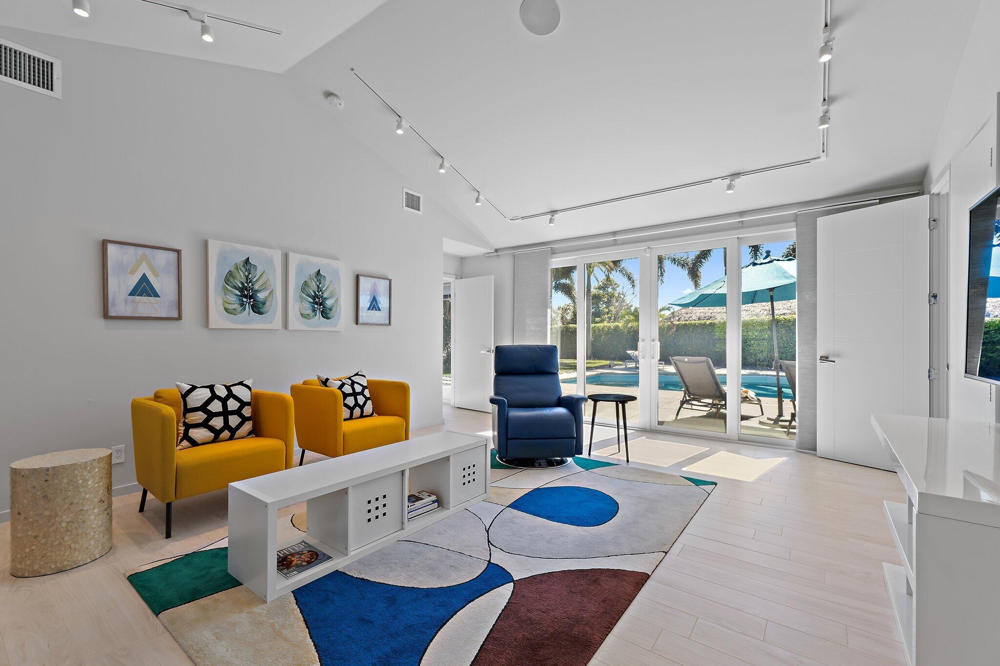 126 Orion Circle Jupiter, FL 33477 - Photo 20 of 82 a living room with furniture and a large window