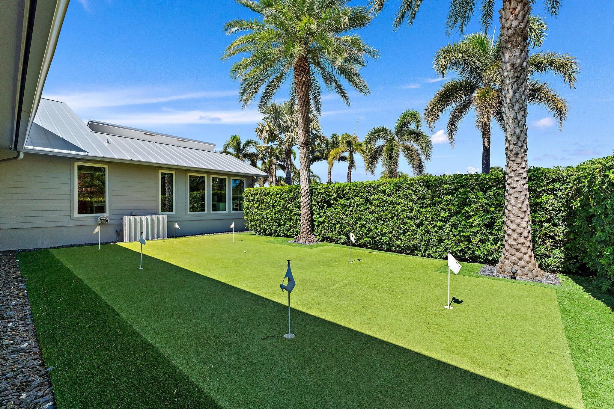 126 Orion Circle Jupiter, FL 33477 - Photo 41 of 82 a view of a backyard with plants