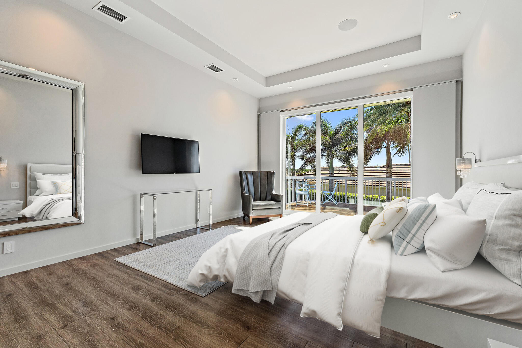 126 Orion Circle Jupiter, FL 33477 - Photo 44 of 82 a bedroom with a bed and a flat screen tv