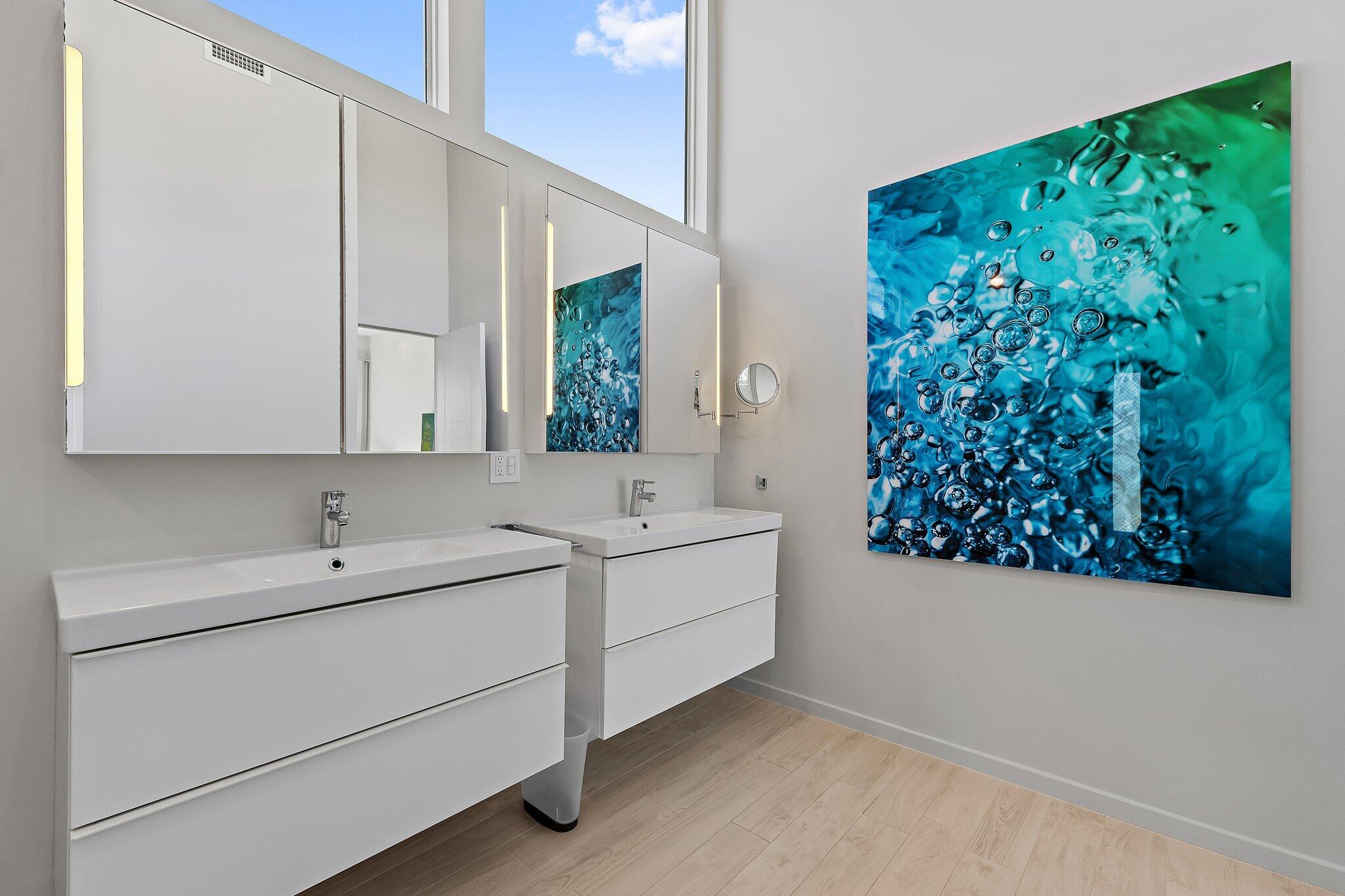 126 Orion Circle Jupiter, FL 33477 - Photo 51 of 82 a bathroom with a sink and a mirror