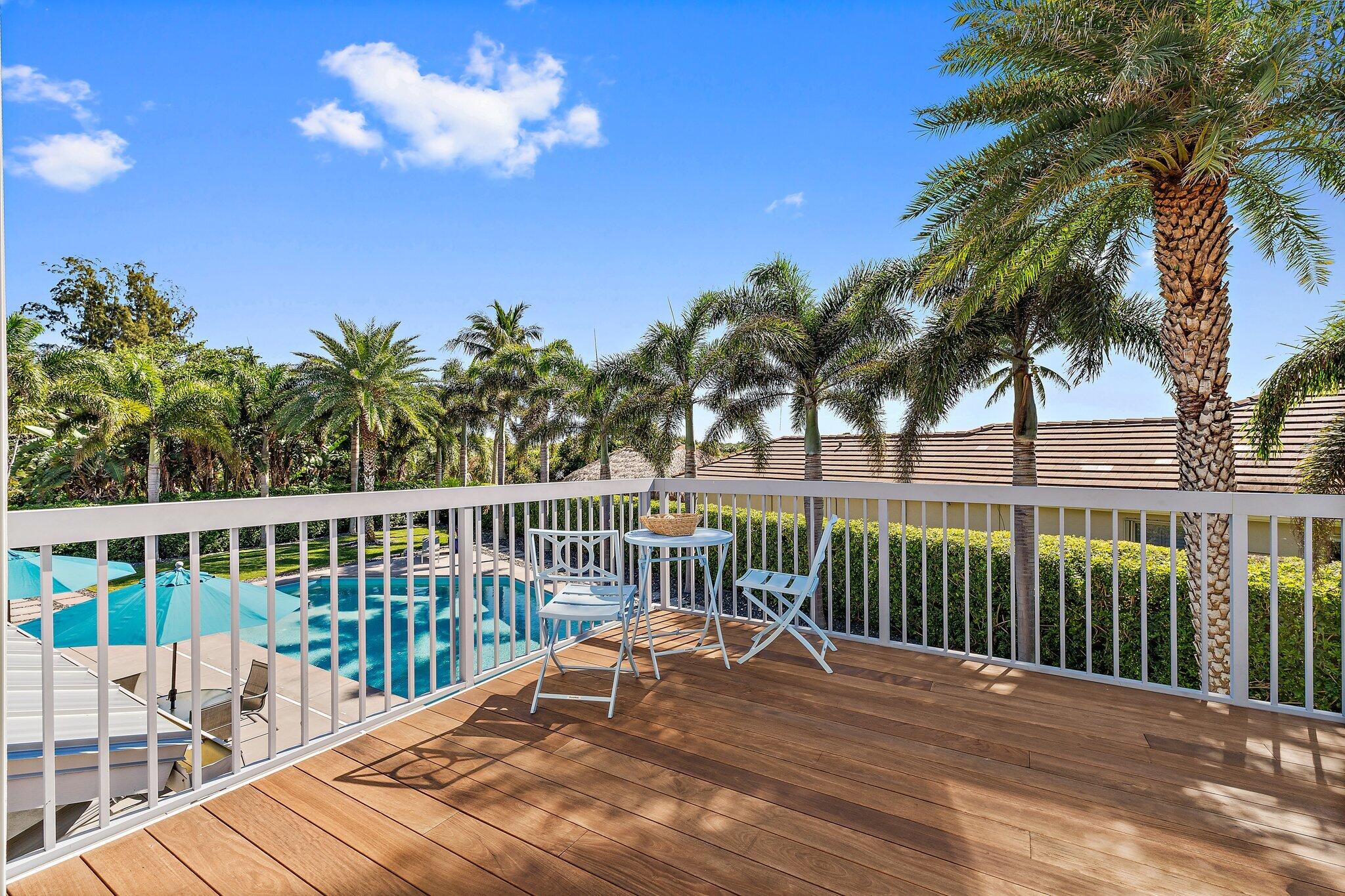 126 Orion Circle Jupiter, FL 33477 - Photo 54 of 82 a view of a balcony with a floor to ceiling window and wooden floor