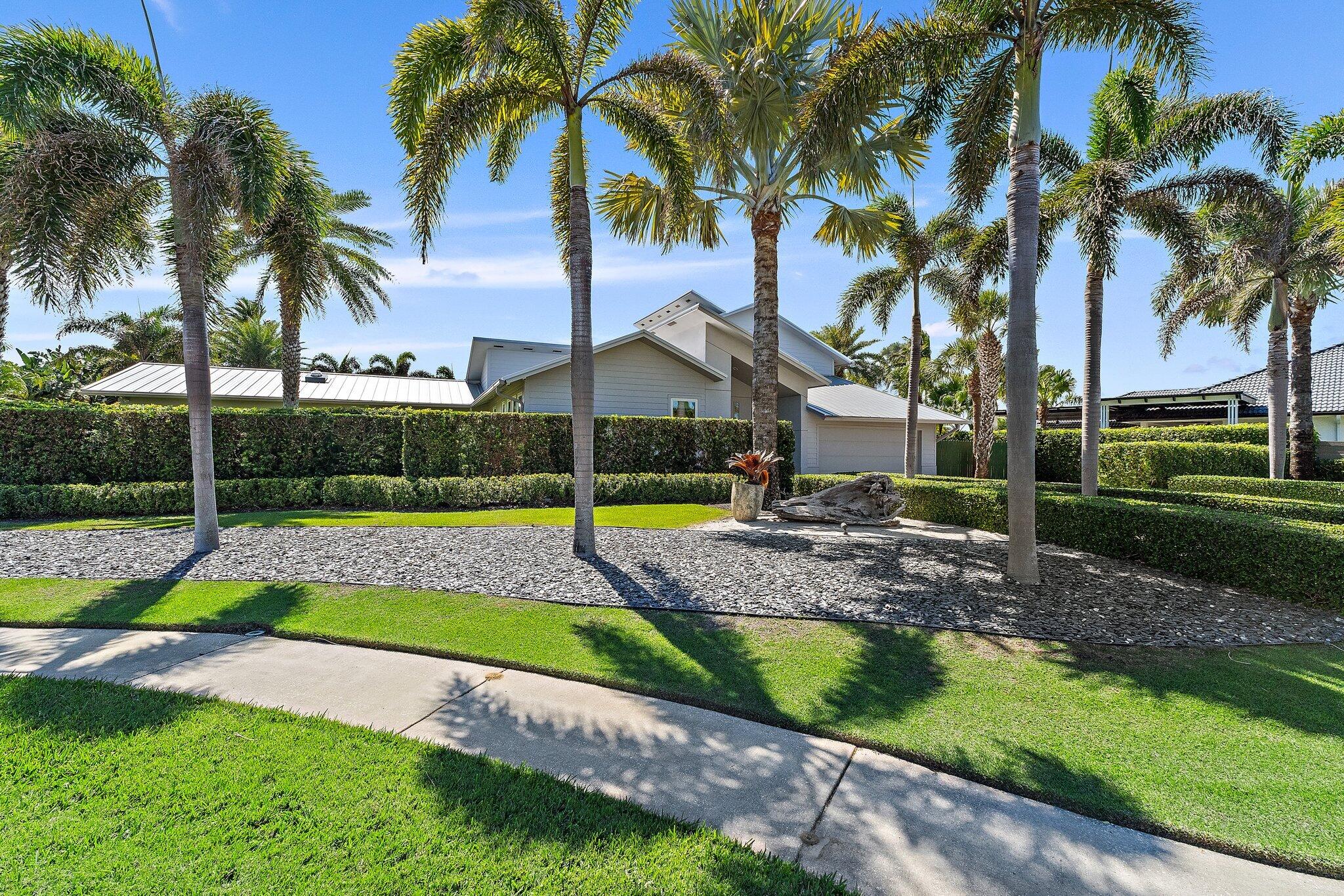 126 Orion Circle Jupiter, FL 33477 - Photo 73 of 82 a view of a yard with palm trees