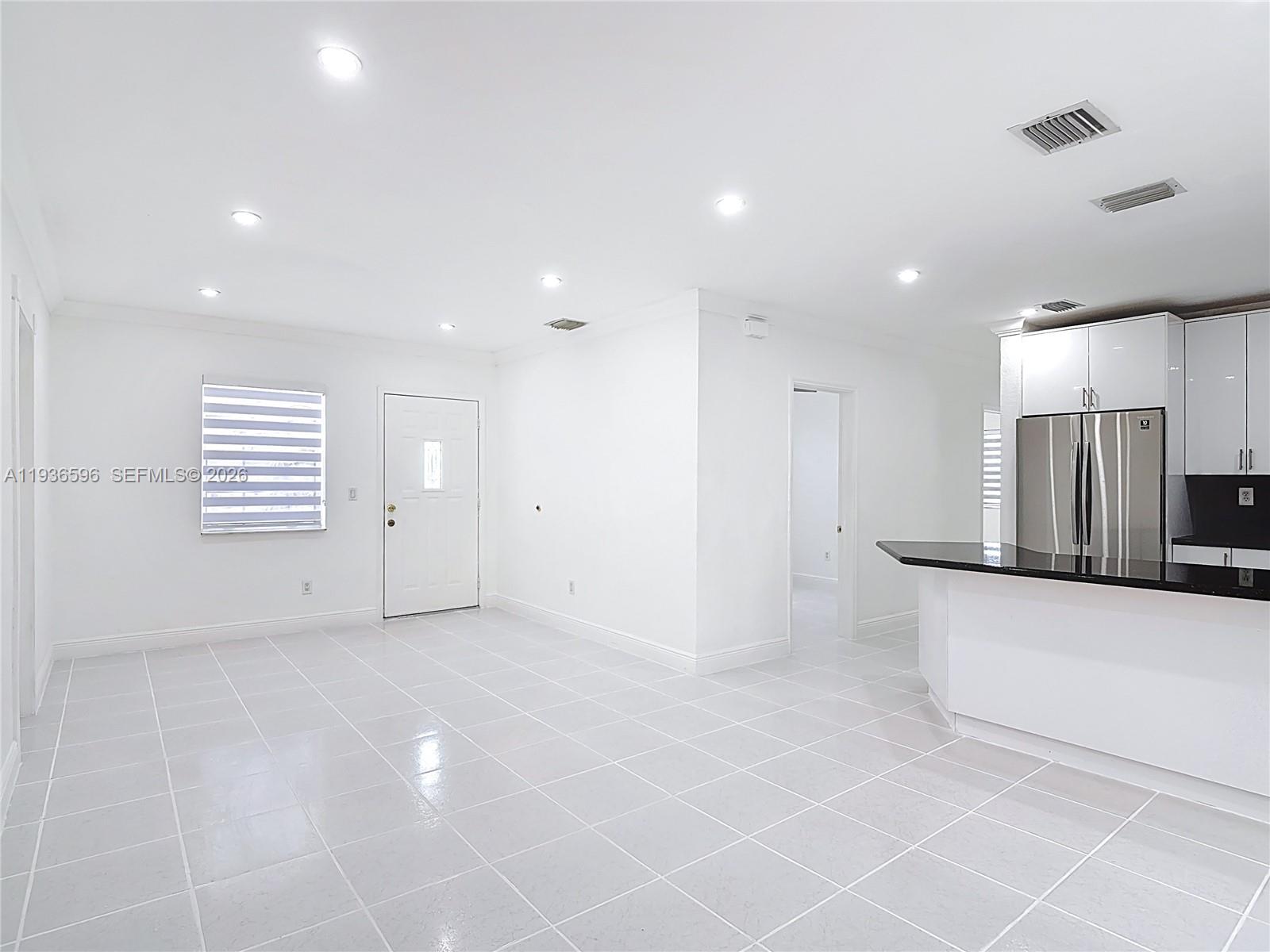 7410 Southwest 39th Street Miami, FL 33155 - Photo 12 of 47 a view of an empty room with a window