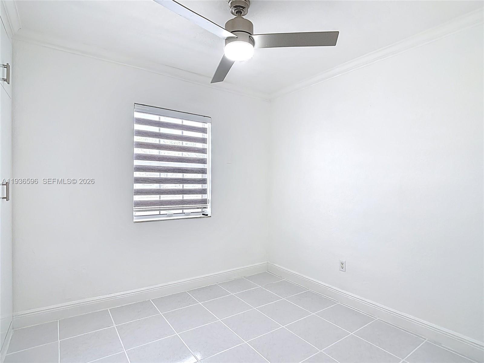 7410 Southwest 39th Street Miami, FL 33155 - Photo 19 of 47 a view of an empty room with a window